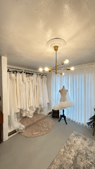 Dress room with wedding gowns and veils