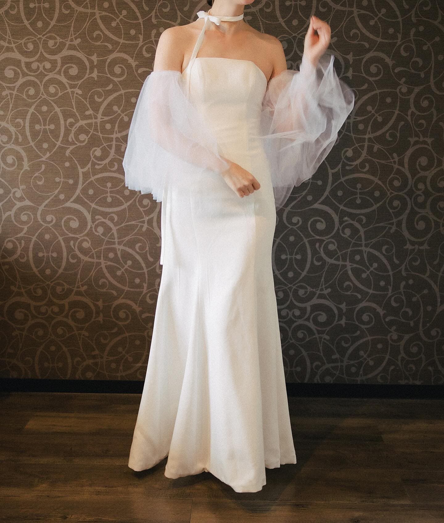 Slim strapless dress styled with sheer tulle balloon sleeves and a ribbon choker