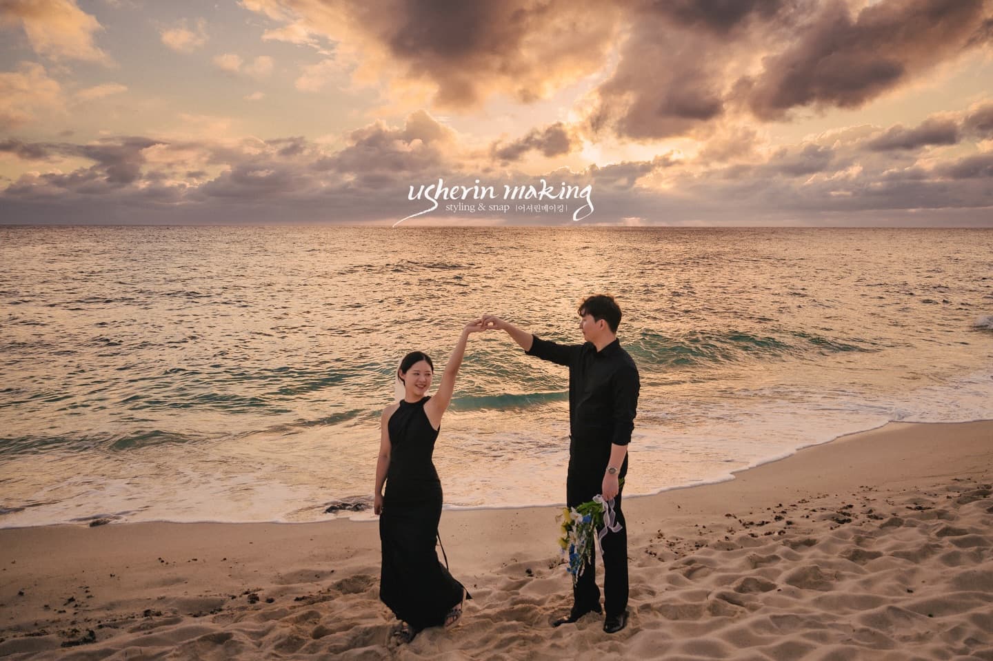 Couple joining hands on a sandy beach beneath a glowing sunset sky in Miyakojima