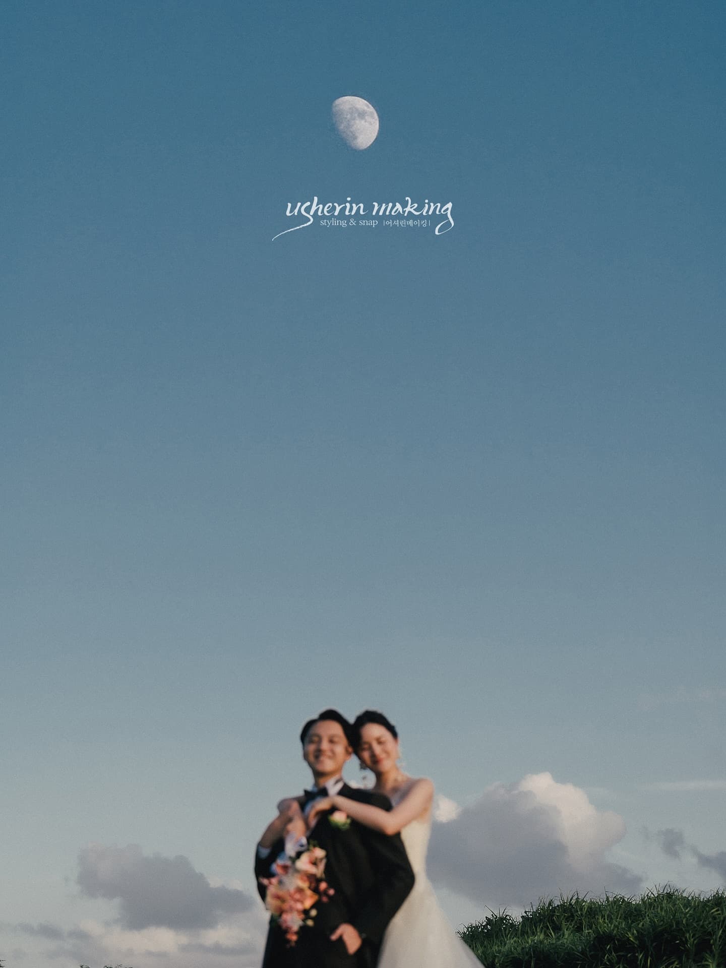 Couple embracing beneath a twilight sky with the moon above in Okinawa