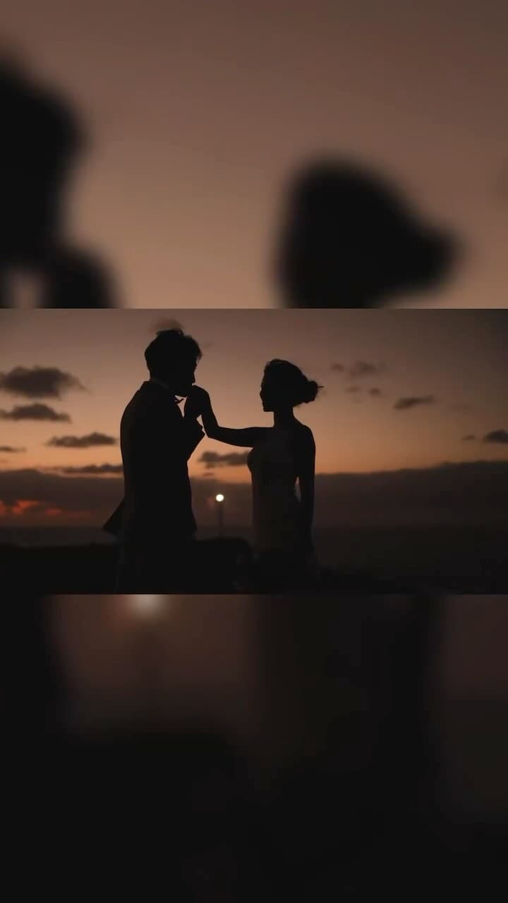 Silhouette of a bride and groom together against the dusk sky in Okinawa